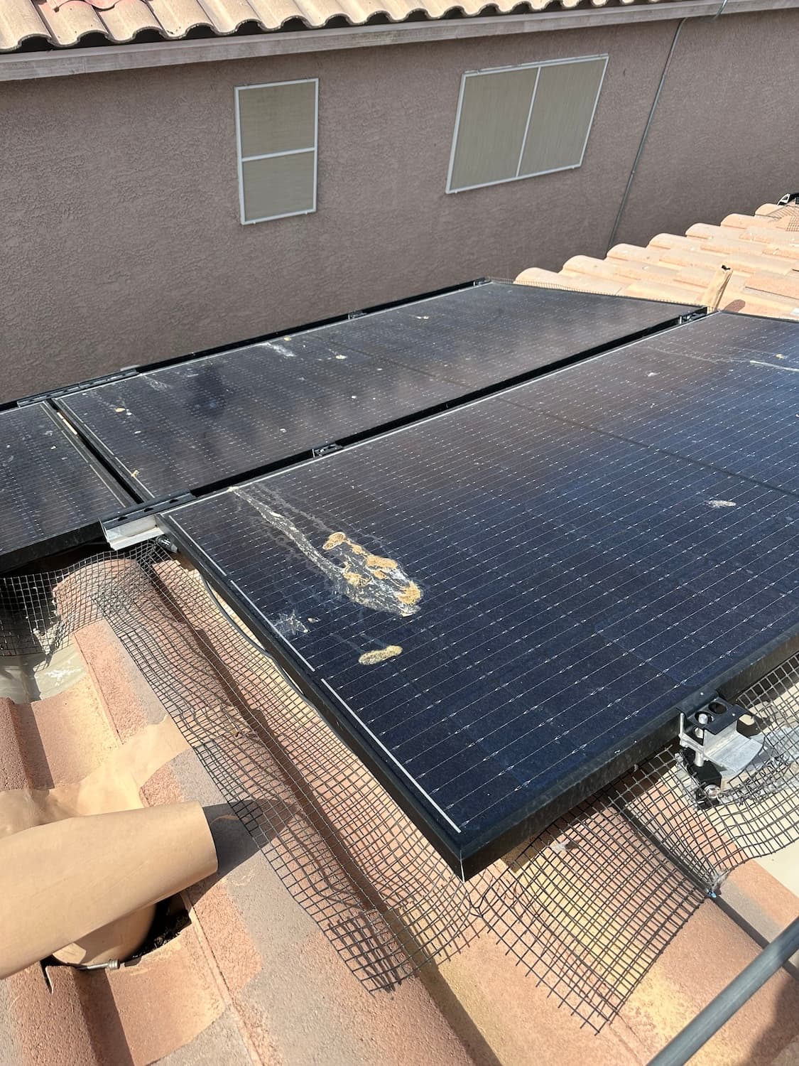 Solar panels covered in dirt and debris before cleaning
